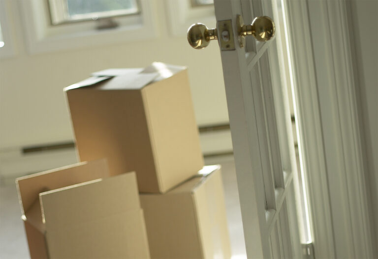 Moving boxes packed in an open house.