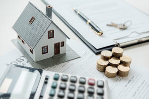 House, contract and calculator - mortgage rate concept