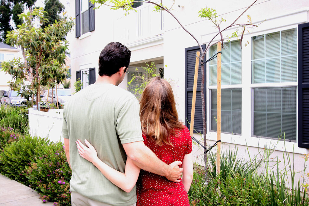 couple looking at new home after completing home buying process