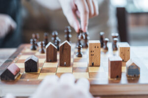 Houses on chess board - real estate expectations concept