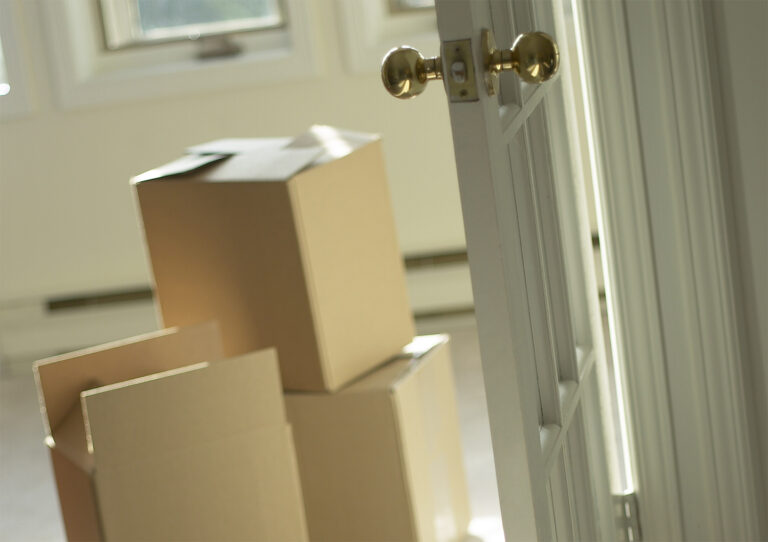 boxes in a room, concept for selling a vacant home