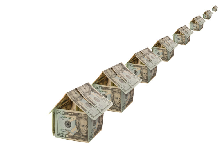 Row of houses made from money, mortgage loan concept to improve credit score.