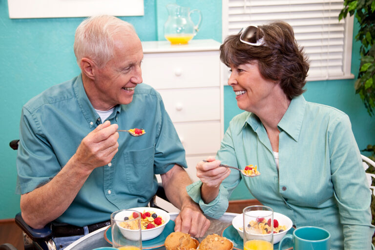 Older couple eating breakfast, representing senior housing trends