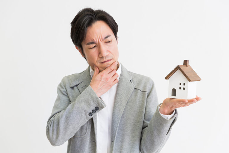 Man examining house, representing home seller pre-inspection