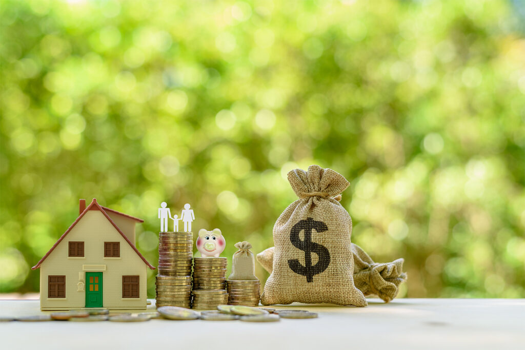 Money and house concept, representing NAR settlement and FAQs asked by home buyers and sellers.