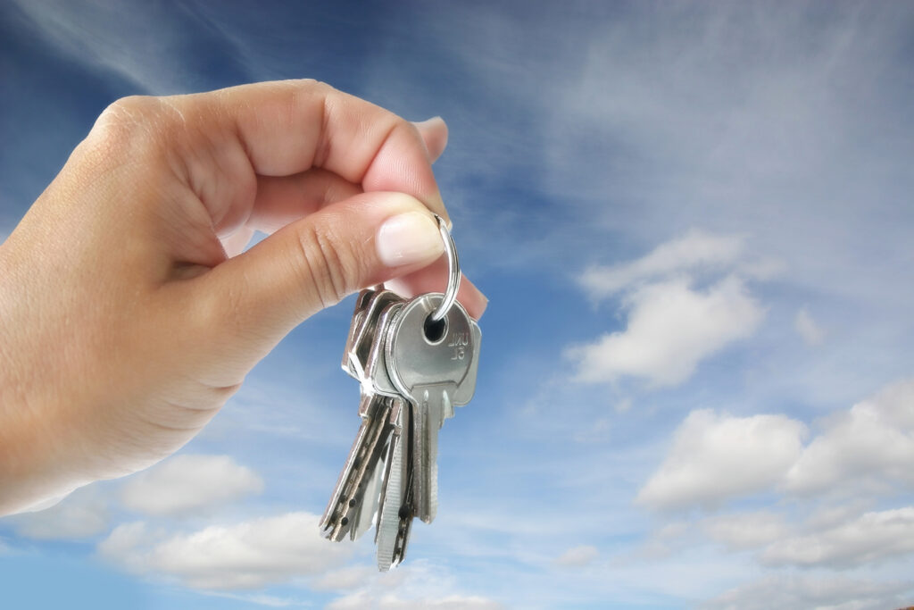 House keys in sky, buy a home, home buying concept