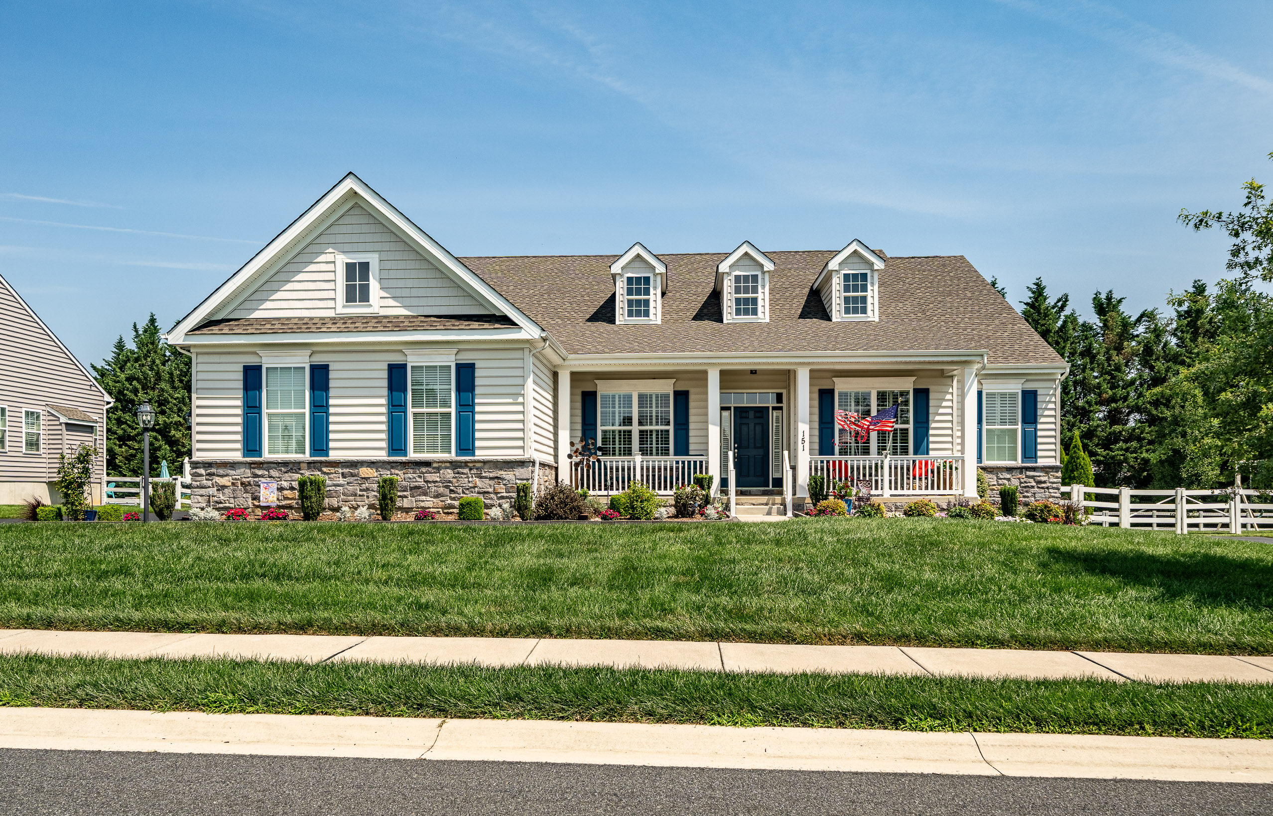 Front exterior of 151 Green Forest, a 2018 main-level-living home in Rothwell Estates, Middletown, DE