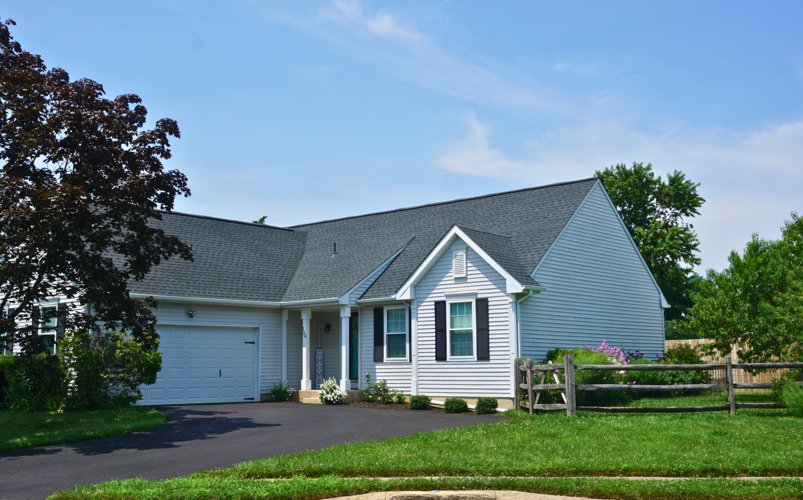 Front exterior of 154 Sugarberry Dr., a single-level ranch home in the Rutledge community, New Castle, DE