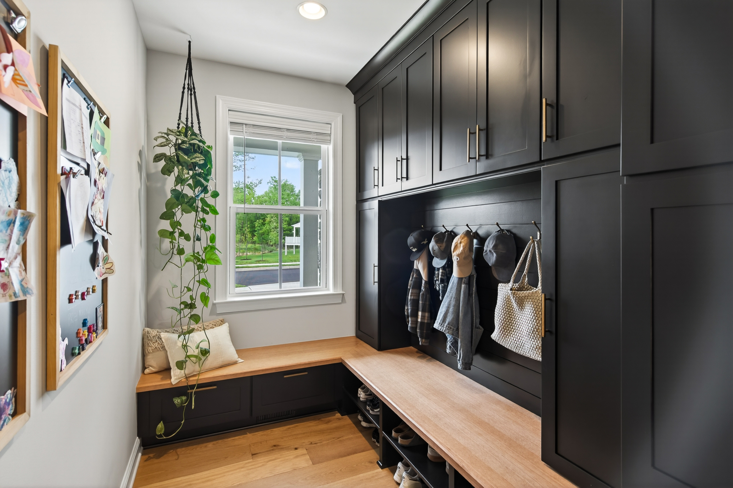 Custom paneled-wood mudroom with built-ins, added by the sellers post-close