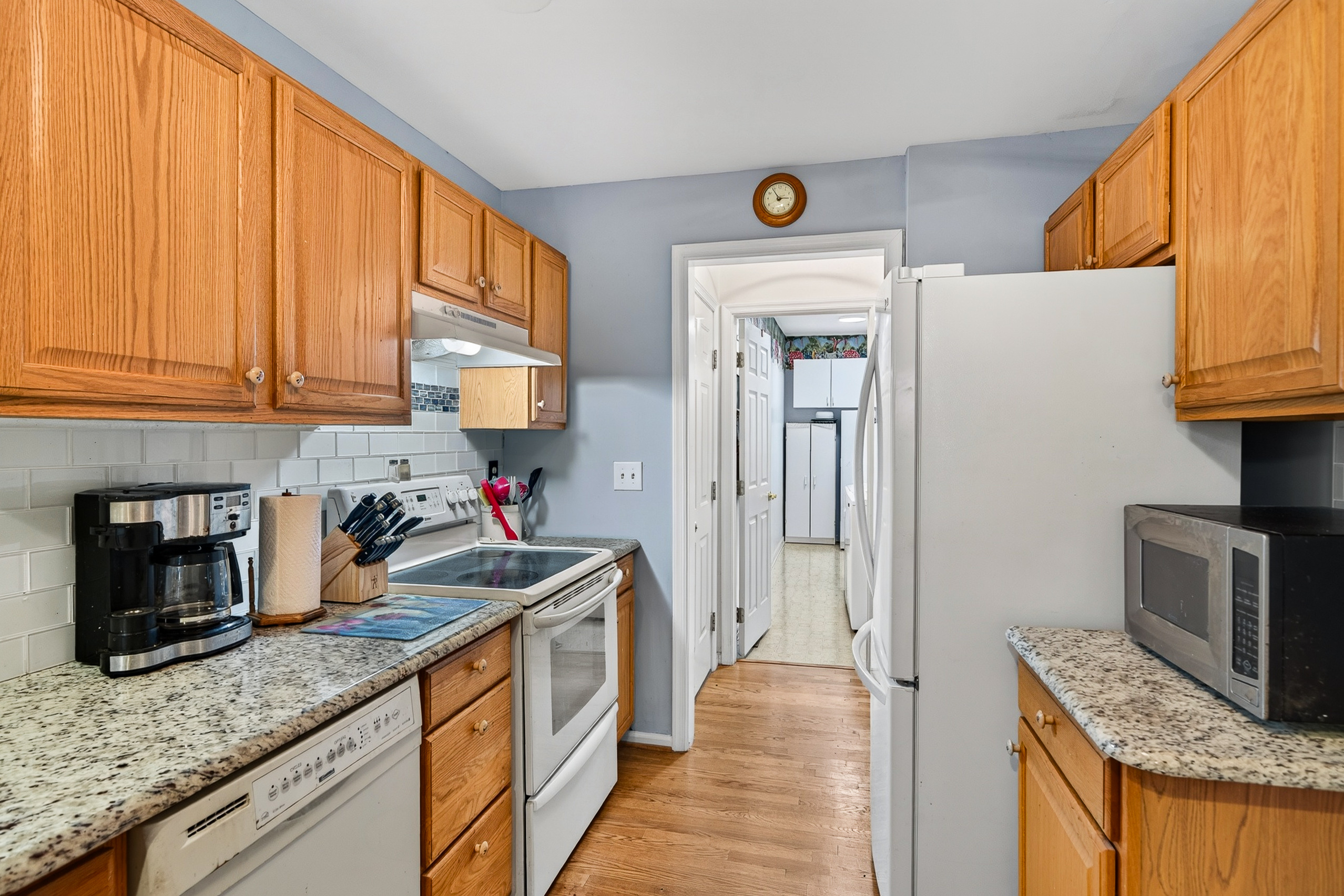 Updated kitchen with granite counters and backsplash