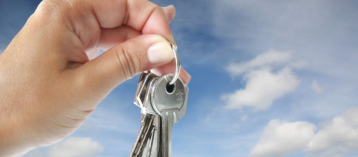 House keys in sky, buy a home, home buying concept