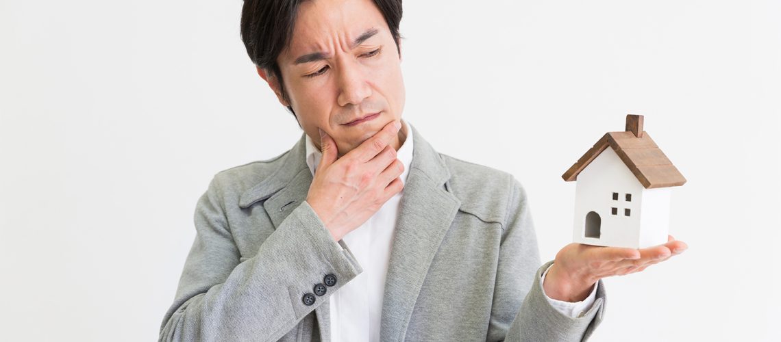 Man examining house, representing home seller pre-inspection