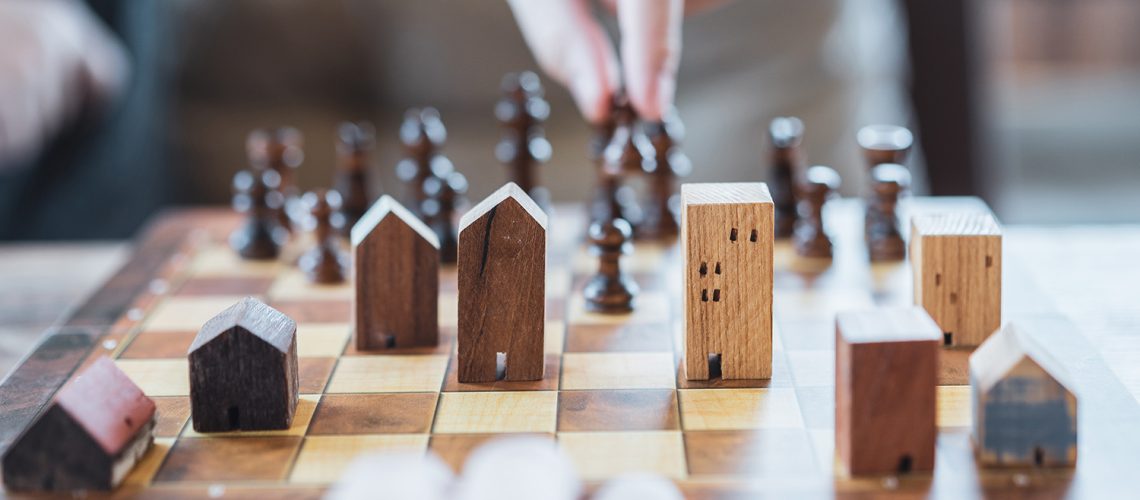 Houses on chess board - real estate expectations concept